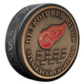 Detroit Red Wings NHL Stanley Cup Years Medallion Hockey Puck product image 1, provided for visual reference and product