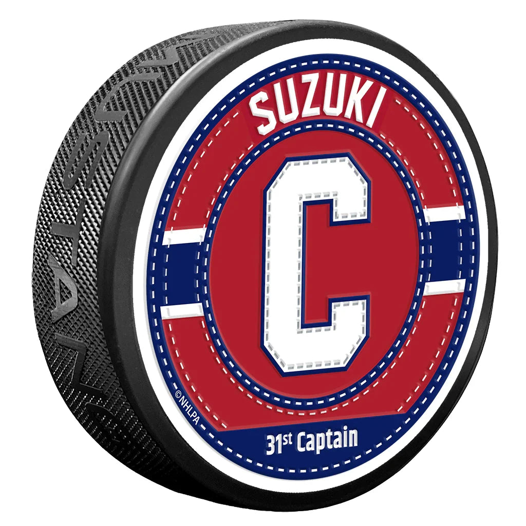 Nick Suzuki Montreal Canadiens NHL Captain Uniform Stitch Hockey Puck product image 1, provided for visual reference and